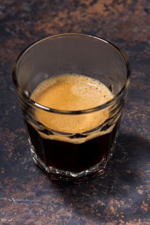 glass of freshly brewed espresso, verticalの写真素材