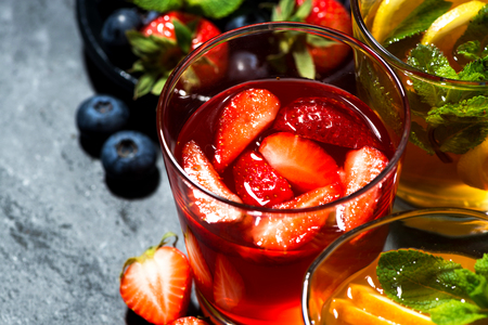 fresh fruit lemonades in assortment on dark background, top viewの写真素材