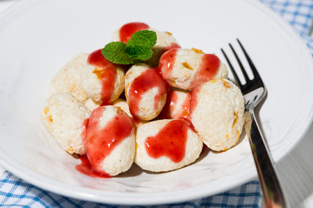 cottage cheese dessert with strawberry sauce, closeup horizontalの写真素材