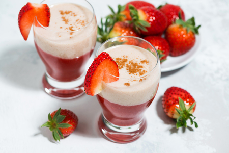 Sweet strawberry yogurt milkshake in glasses, top view horizontalの写真素材