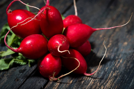 Bunch fresh radishes on wooden