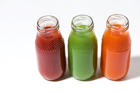 colorful vegetable juices in bottles, top view horizontalの写真素材