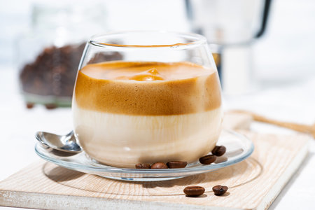 milky coffee with cream foam, closeup horizontal