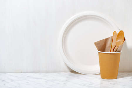 eco-friendly disposable tableware made from recycled materials on white background, closeup horizontalの写真素材