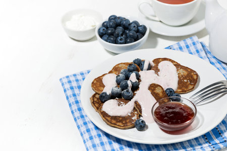 homemade pancakes with blueberries and jam, horizontalの写真素材