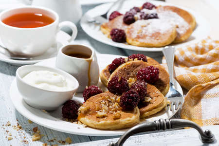 sweet corn pancakes with berries and caramel sauce for breakfast, horizontalの写真素材