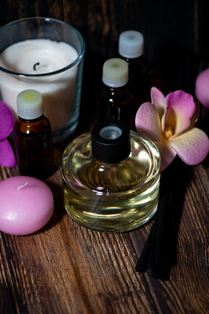 attributes of spa treatments - candles, aroma diffuser, rattan sticks and aroma oils, top viewの写真素材