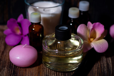 attributes of spa treatments - candles, aroma diffuser, rattan sticks and aroma oils, closeup...