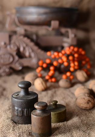 weights, walnuts and viburnum on sackingの写真素材