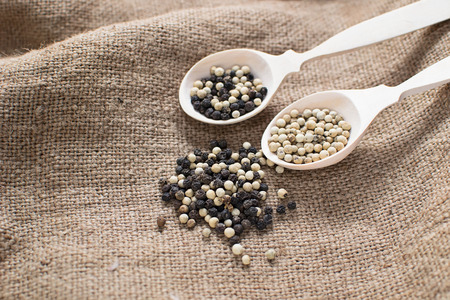 Black and white peppers in sackingの写真素材