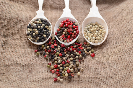 Black, white and mix peppers in sackingの写真素材