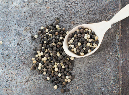 Black and white pepper in abstract backgroundの写真素材