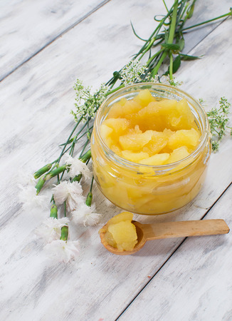 Jam in jar on a light wooden backgroundの写真素材