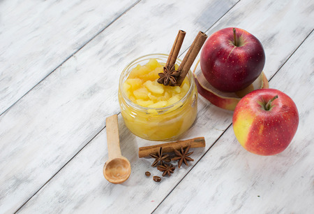 Jam in jar on a light wooden backgroundの写真素材