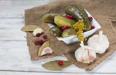 Pickled homemade cucumbers with cranberriesの写真素材