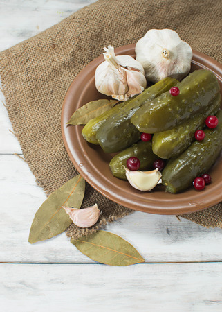 Pickled homemade cucumbers with cranberriesの写真素材