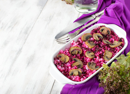 Risotto with mushrooms and beetroot with copyspace compositionの写真素材