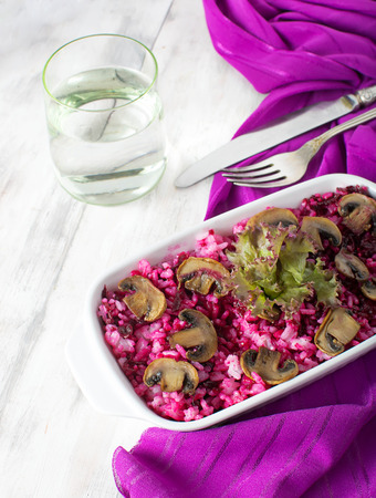 Risotto with mushrooms and beetroot on a light の写真素材