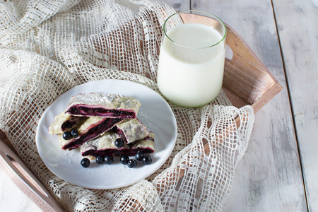 Breakfast with milk and baking  on a trayの写真素材