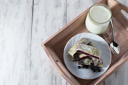 Breakfast with milk and baking  on a trayの写真素材