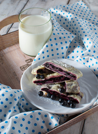 Breakfast with milk and baking  on a trayの写真素材