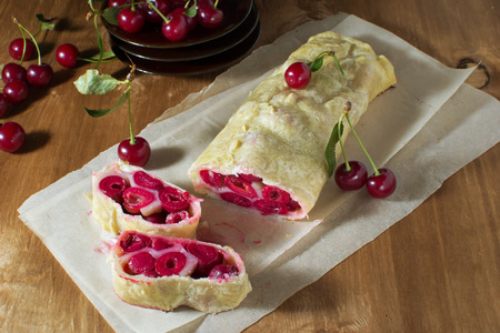Homemade cherry strudel on paper napkinの写真素材