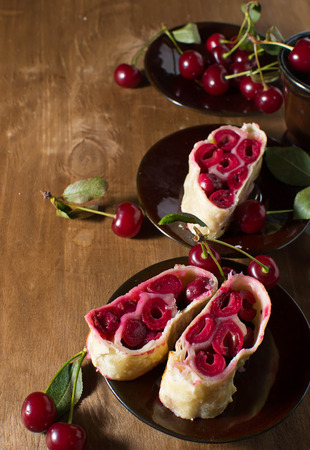 Homemade cherry strudel on paper napkinの写真素材