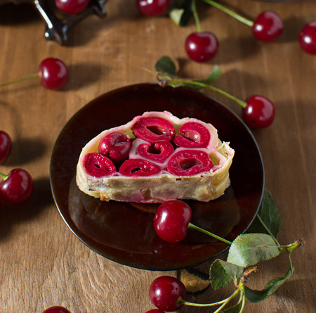 Homemade cherry strudel on paper napkinの写真素材