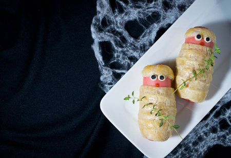 Halloween sausage in the dough decorated to look like mummies の写真素材