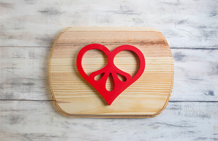 Valentines background with red wooden heartの写真素材