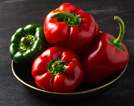 Sweet red Bulgarian pepper on dark background