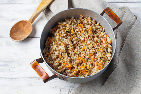Buckwheat with carrots in light background. Selective focusの写真素材