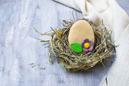 Easter homemade cookie in shape of egg. Selective focus. Space for text
