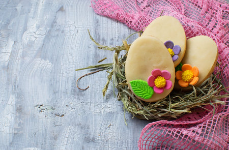 Easter homemade cookie in shape of egg. Selective focus. Space for text