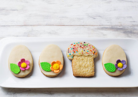 Easter homemade cookie in shape of egg. Selective focus. Space for text