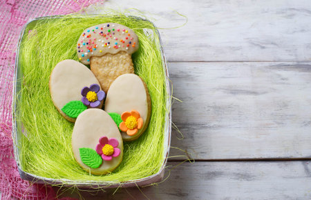 Easter homemade cookie in shape of egg. Selective focus. Space for text