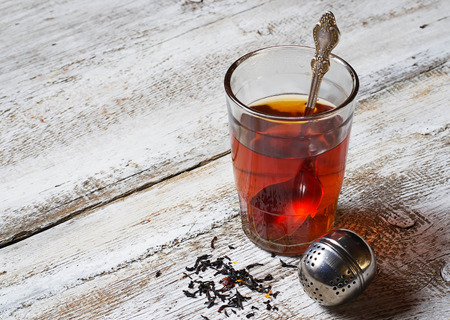 Tea in glass and strainer. Selective focusの写真素材