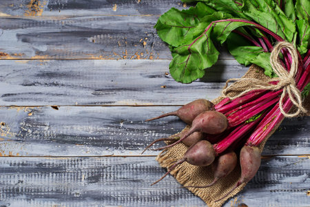 Fresh raw beetroot on wooden background