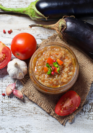 Eggplant caviar in a glass jar. Selective focusの写真素材