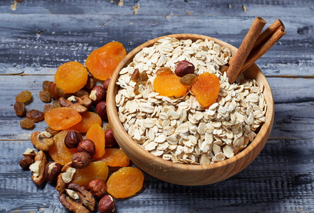 Ingredient for granola: oatmeal, honey, dried fruits, nuts. Selective focusの写真素材