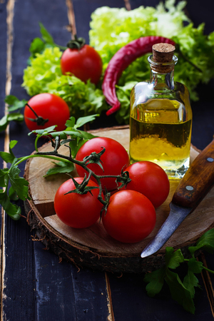 Fresh cherry tomato, parsley and olive oil. Selective focusの写真素材