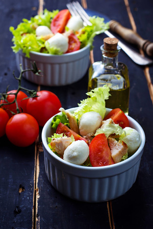 Salad with chicken, tomato and mozzarella. Selective focusの写真素材