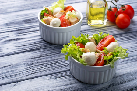 Salad with chicken, tomato and mozzarella. Selective focusの写真素材