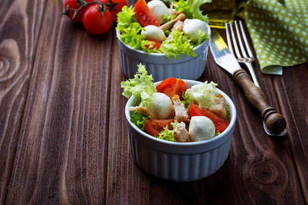 Salad with chicken, tomato and mozzarella. Selective focusの写真素材
