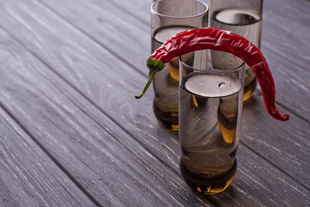 Vodka and chilli pepper. Selective focusの写真素材