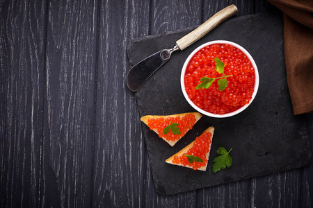 Red caviar on slate background. Selective focusの写真素材