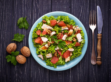 Salad with chicken and grapefruit. Selective focusの写真素材