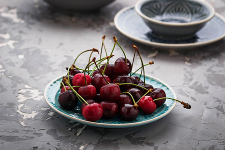 Sweet ripe cherry in bowl. Selective focusの写真素材