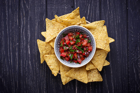 Mexican corn chips nachos with salsa dip. Selective focusの写真素材