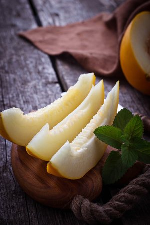 Fresh sweet sliced melon with mint. Selective focusの写真素材